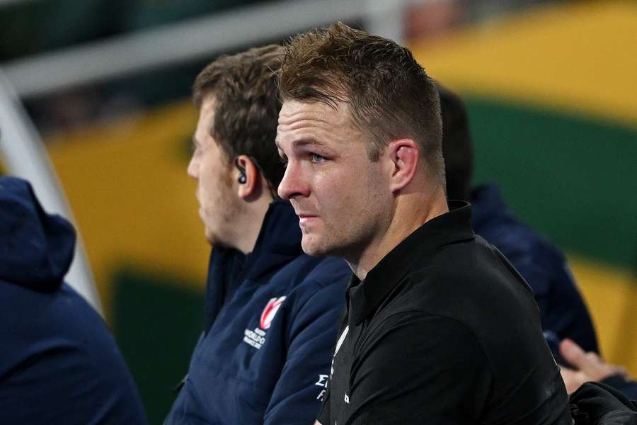 Sam Cane of New Zealand reacts from the bench after having his yellow card upgraded to a red card