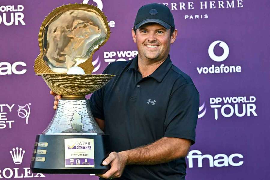 Patrick Reed with his trophy in Qatar