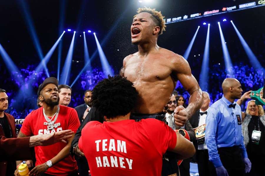 Devin Haney celebrates after defeating Vasyl Lomachenko of Ukraine