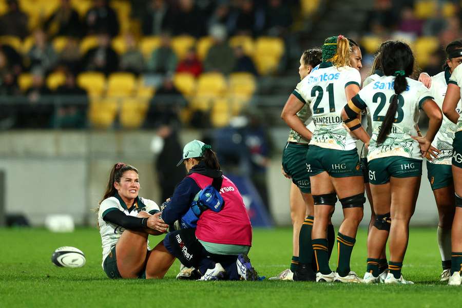 Charlotte Caslick receives medical attention against New Zealand in Wellington last month.