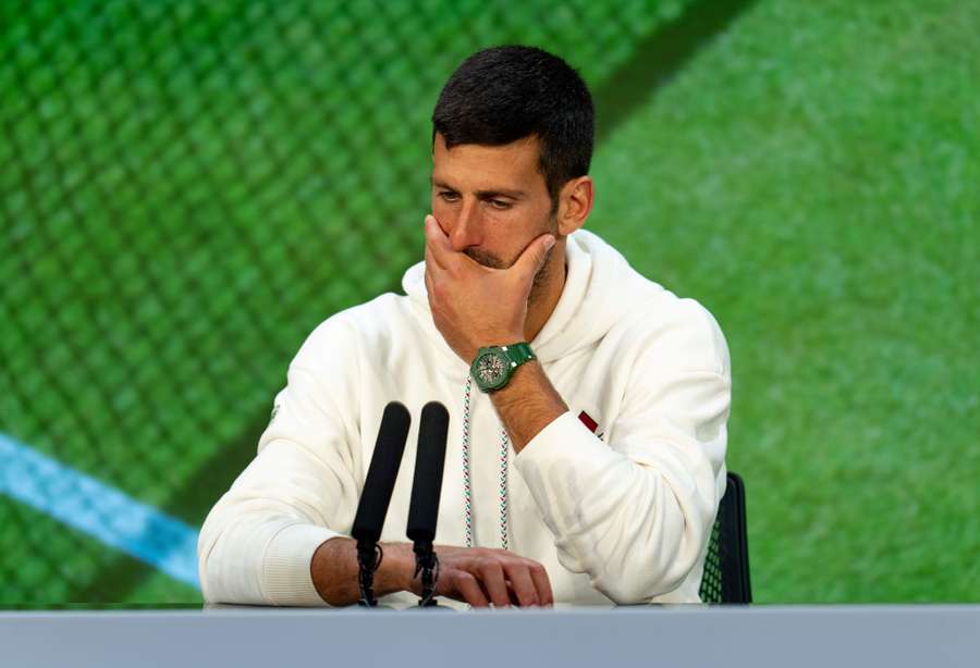 Novak Djokovic reacts as he speaks during a press conference after the final