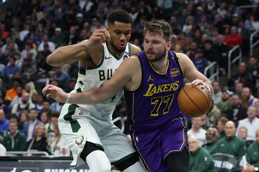Lakers guard Luka Doncic dribbling by Bucks forward Giannis Antetokounmpo (2025)