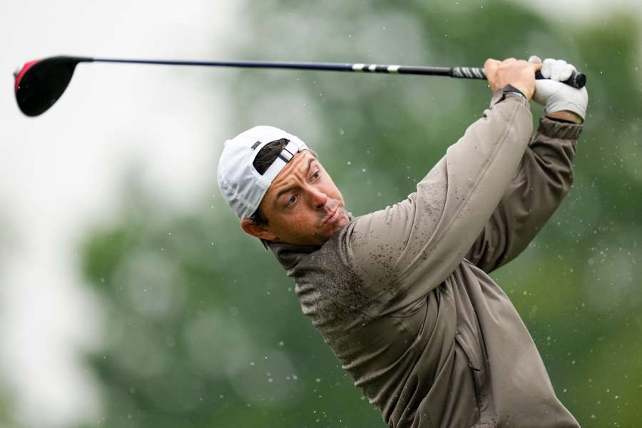 To avoid the distraction of rain dripping off his visor and into his line of sight, McIlroy opted to join the backward hat brigade at Oak Hill