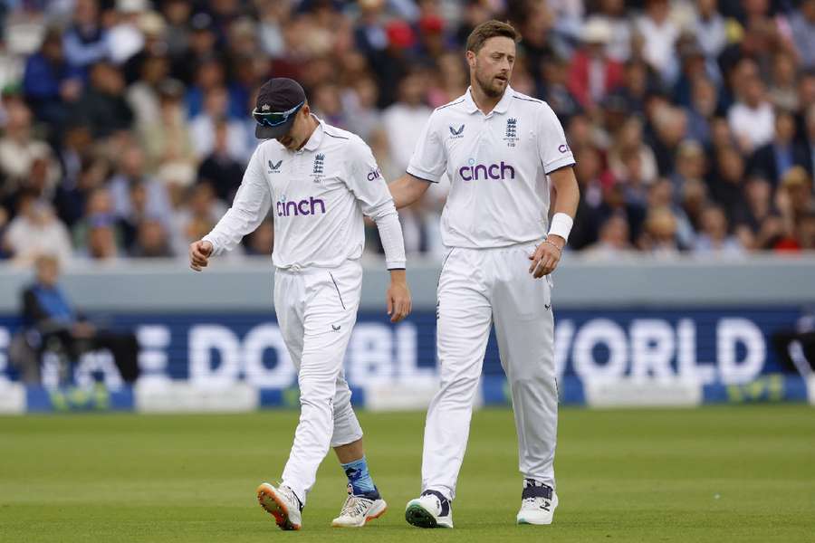 England's Ollie Pope walks off for medical attention after injuring his shoulder in the second Test