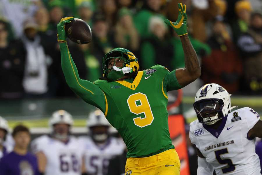 Oregon's Jamari Johnson catches a touchdown pass against James Madison in the 2025 College Football Playoffs