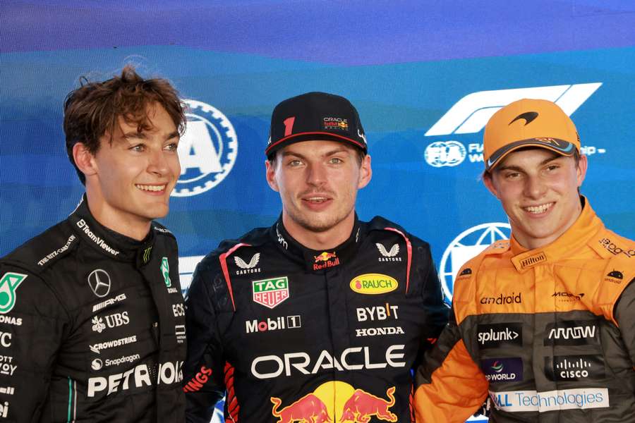 Red Bull Racing's Dutch driver Max Verstappen (C), Mercedes' British driver George Russell (L), and McLaren's Australian driver Oscar Piastri (R) pose for a picture together