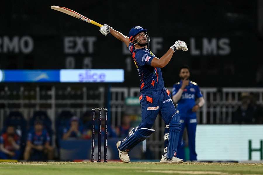 Lucknow Super Giants' Marcus Stoinis watches the ball after playing a shot
