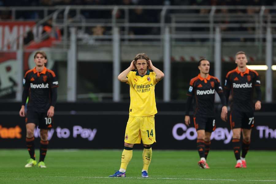 Luka Modric reacts after Como's goal
