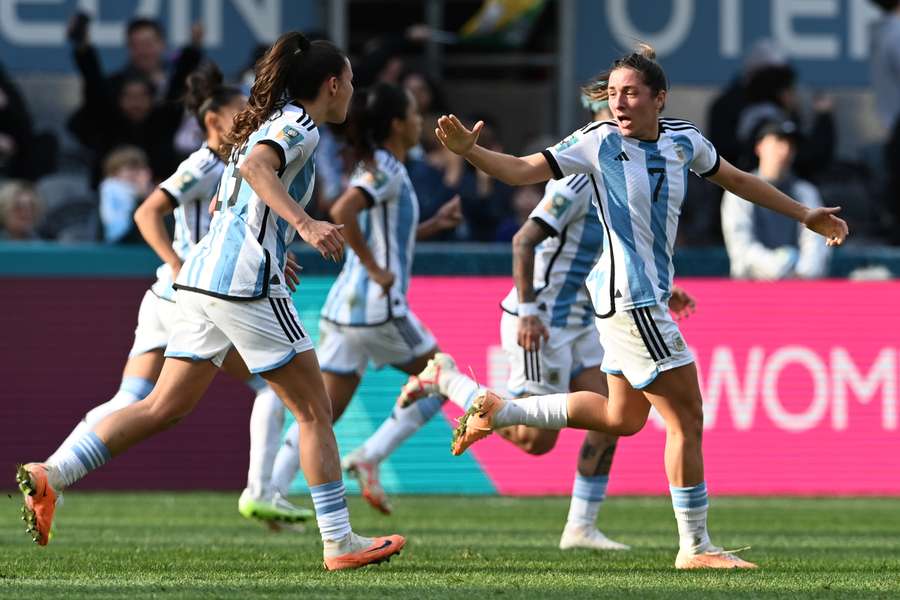 Argentina's midfielder #07 Romina Nunez (R) celebrates scoring her team's second goal 