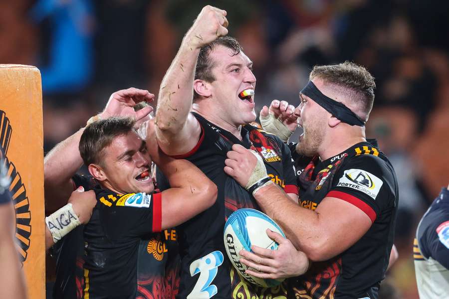 Chiefs' Brodie Retallick (C) celebrates scoring a try during the Super Rugby semi-final match