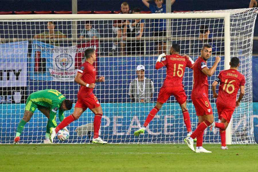 Sevilla's Moroccan forward Youssef En-Nesyri, centre, celebrates scoring Sevilla's first goal