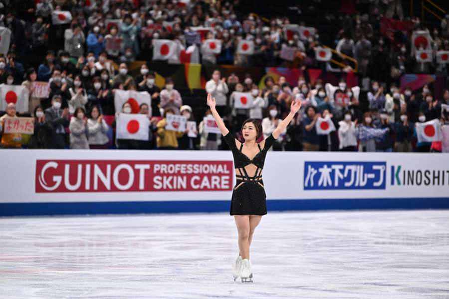 Sakamoto celebrates after taking the lead in the women's short programme