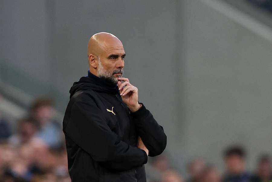 Man City boss Guardiola watches on