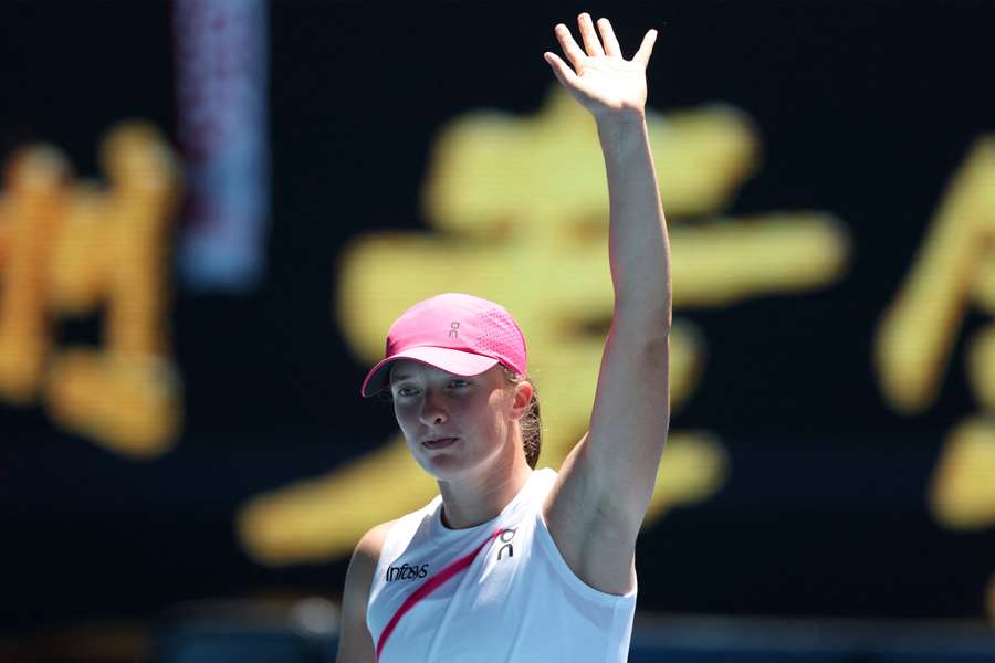 Top seed Iga Swiatek celebrates winning her first match at the Australian Open