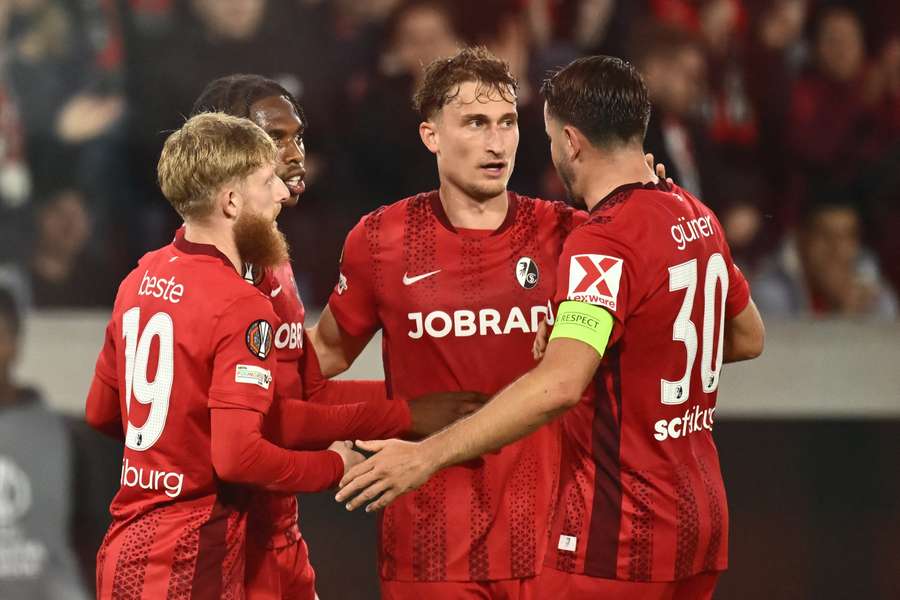 Freiburg's Patrick Osterhage celebrates scoring his team's first goal 