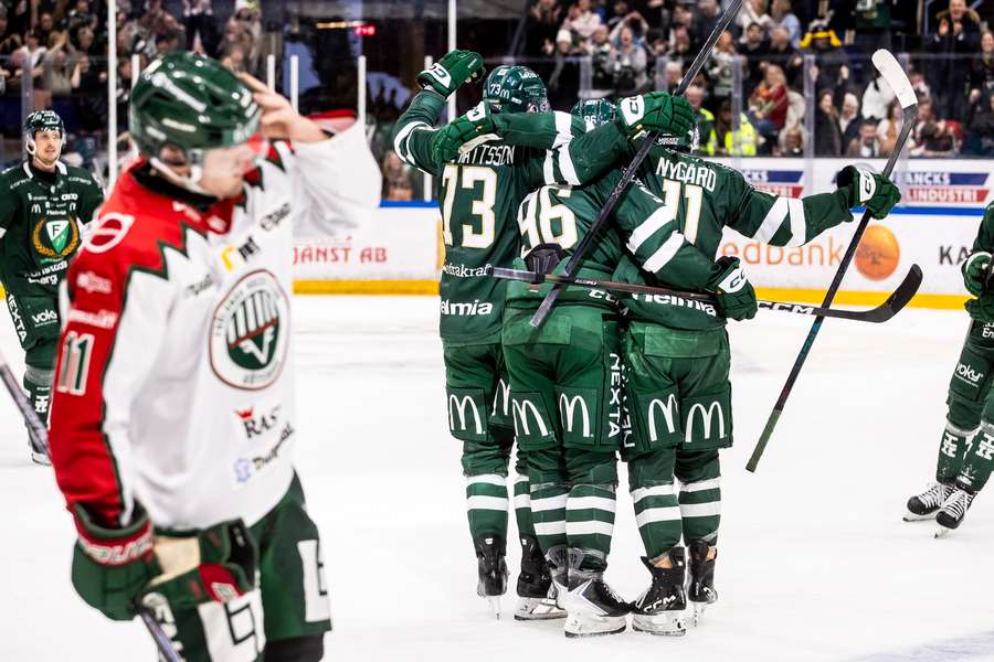 Farjestad players celebrate victory over Frolunda
