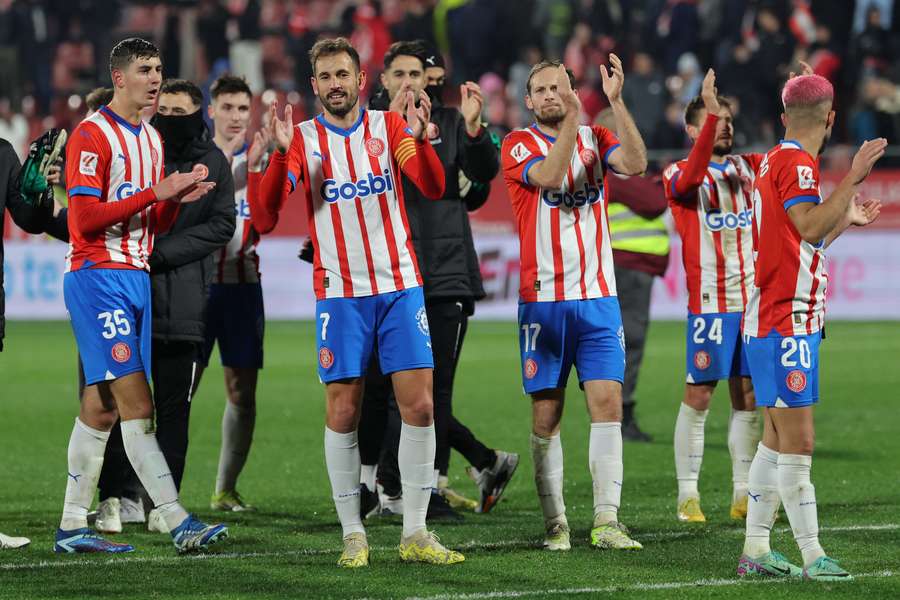 Girona applaud their fans after winning