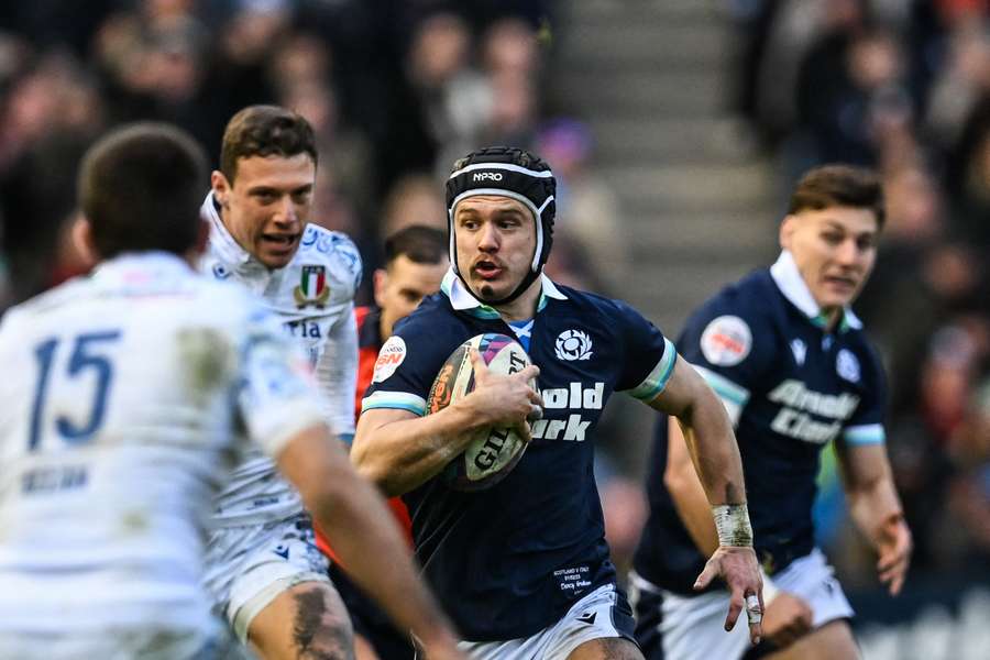 Darcy Graham runs with the ball during Scotland's Six Nations clash with Italy last month