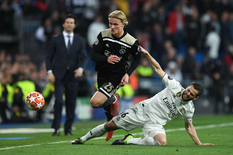 Kasper Dolberg rushes past Nacho Fernandez during the Champions League game between Ajax and Real Madrid in 2019 Kasper Dolberg rushes past Nacho Fernandez during the Champions League game between Ajax and Real Madrid in 2019
