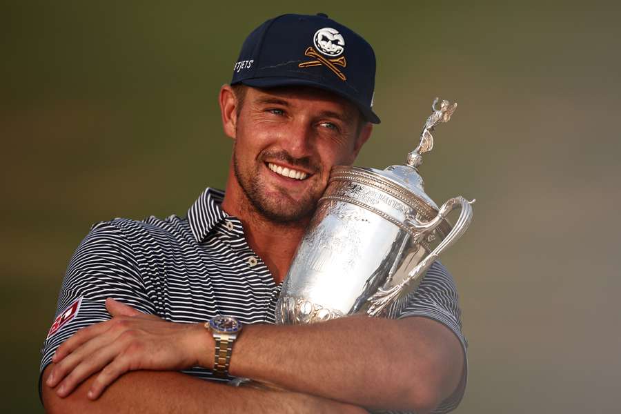 Bryson DeChambeau poses with the trophy after winning the 124th US Open