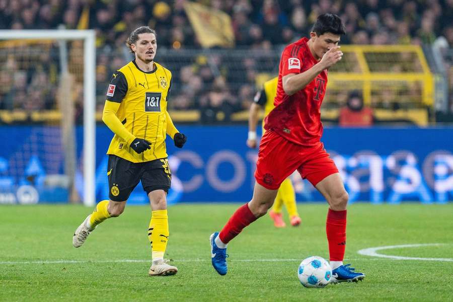 Dortmunds Marcel Sabitzer (l.) und Bayern-Profi Kim (r.)