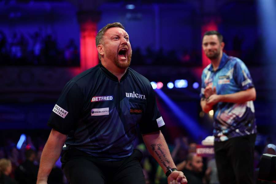 Menzies celebrates as Humphries watches on Menzies celebrates as Humphries watches on