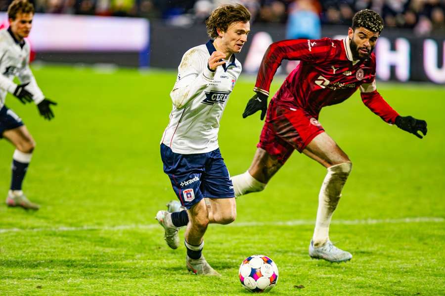 AGFs Magnus Knudsen  in action against FC Midtjylland's Phillip Billing