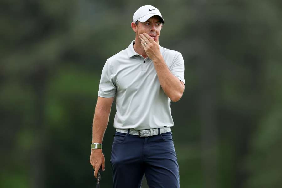 Rory McIlroy of Northern Ireland reacts to a putt