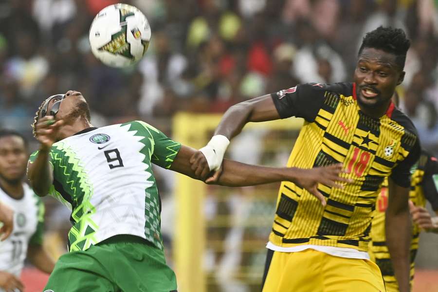 Nigeria's Victor Osimhen (L) vies with Ghana's Daniel Amartey during the sides' last clash in 2022