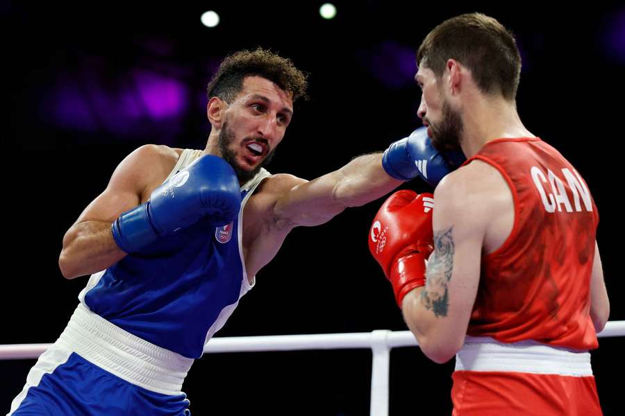 Sofiane Oumiha (left) of France in action against Wyatt Sanford of Canada