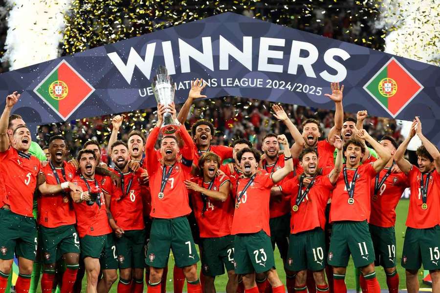 The Portugal squad celebrate with the Nations League trophy. The Portugal squad celebrate with the Nations League trophy.