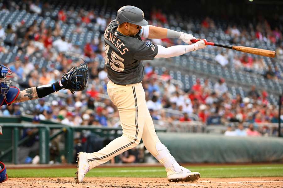 Washington Nationals designated hitter Joey Meneses hits a solo home run in a 7-2 defeat to the Rangers