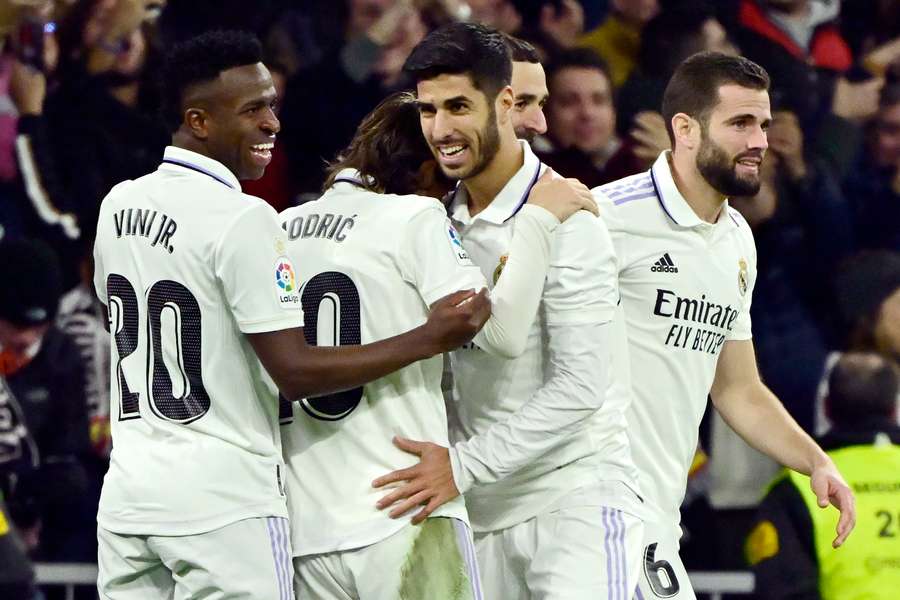 Marco Asensio celebrates scoring the opening goal against Valencia