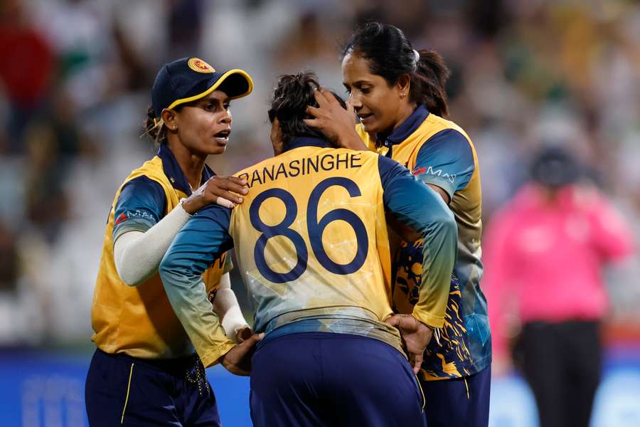 Sri Lanka's Oshadi Ranasinghe celebrates with teammates after the dismissal of South Africa's Sinalo Jafta 