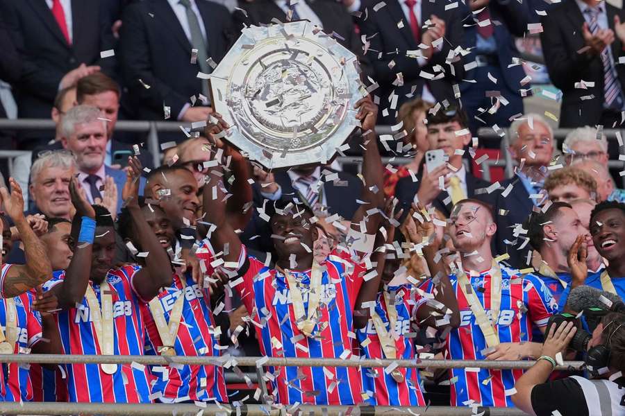 Crystal Palace players celebrate with the Community Shield after beating Liverpool at Wembley