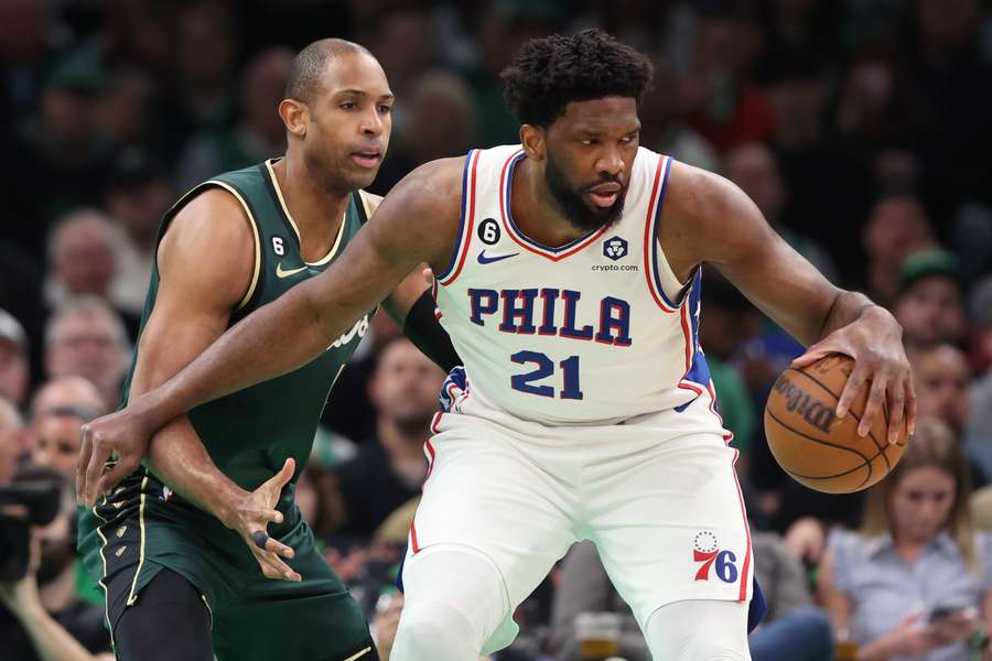  Al Horford of the Boston Celtics defends Joel Embiid of the Philadelphia 76ers