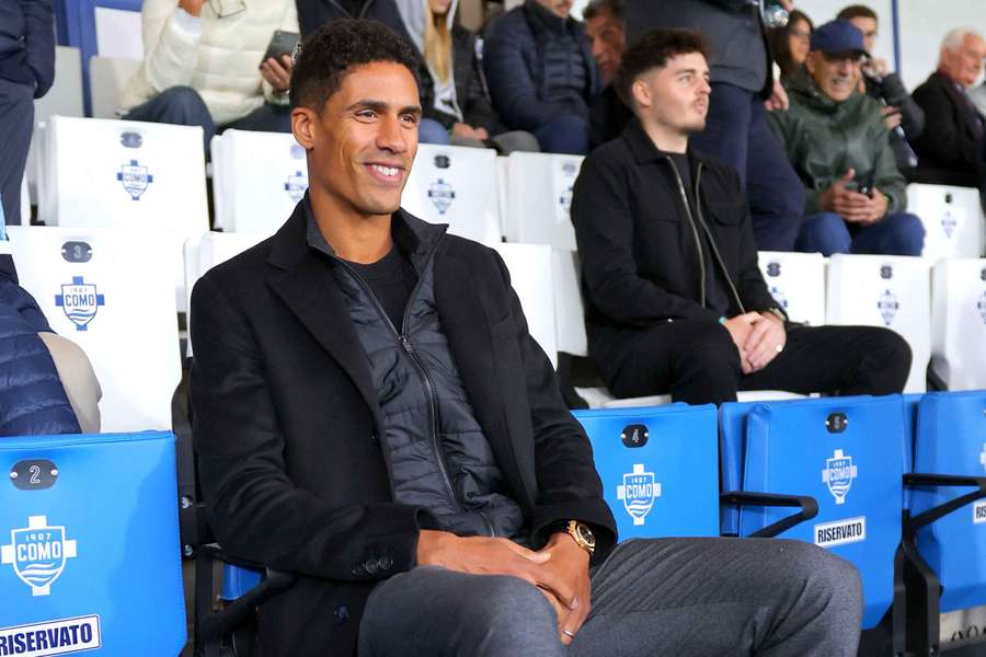 Raphael Varane sits in the stands ahead of Como's Serie A match against Parma