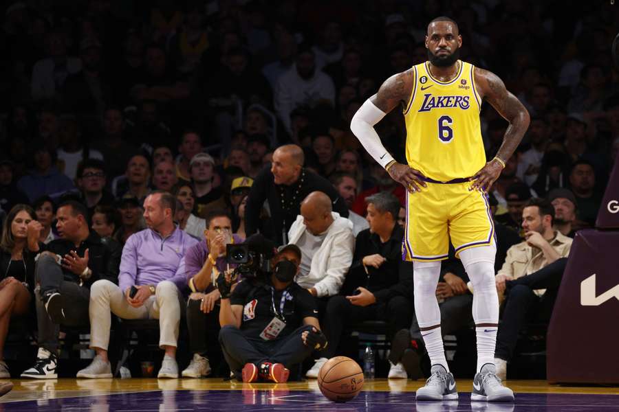 LeBron watches on during the Lakers' loss to Denver