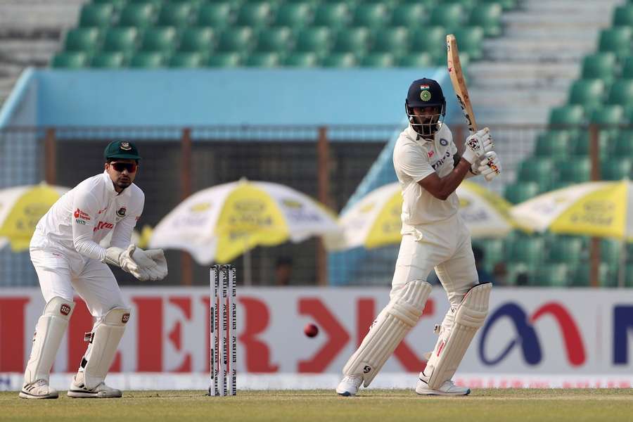 Rahul punching a shot through cover