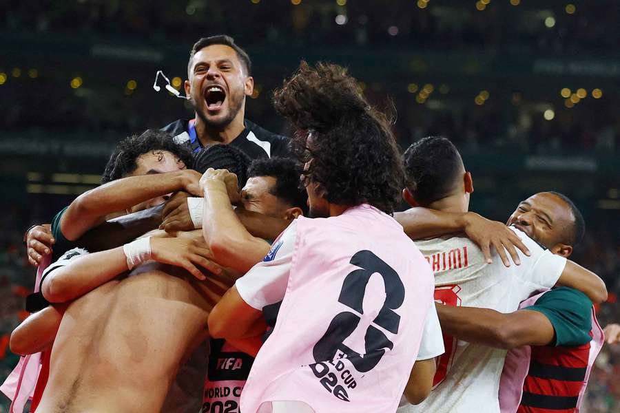 Morocco's Ayoub El Kaabi and teammates celebrate after the penalty shootout as Morocco qualify for the round of 16 stage of the World Cup