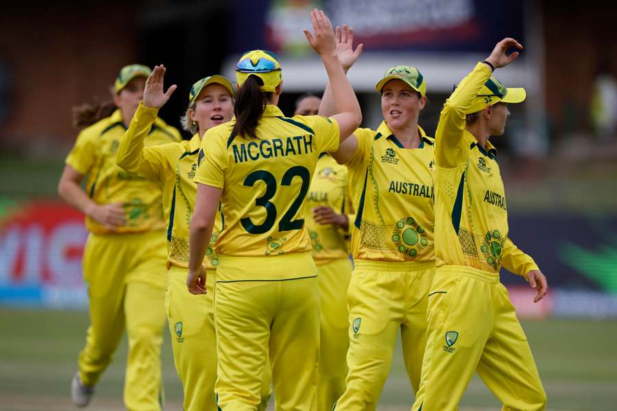 Australia's Tahlia Mcgrath (C) celebrates with teammates after the dismissal of Sri Lanka's Oshadi Ranasinghe