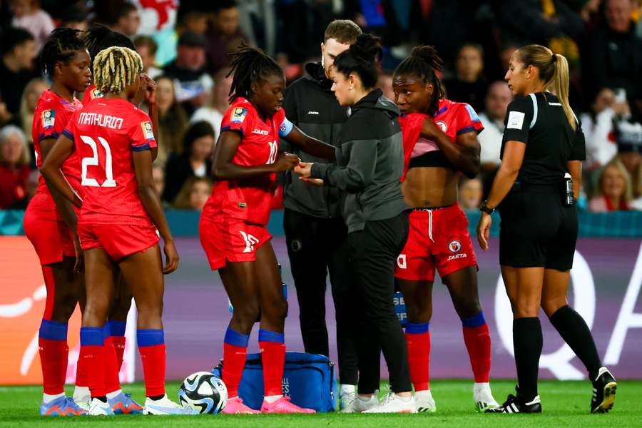 Haiti's players receive instructions against England