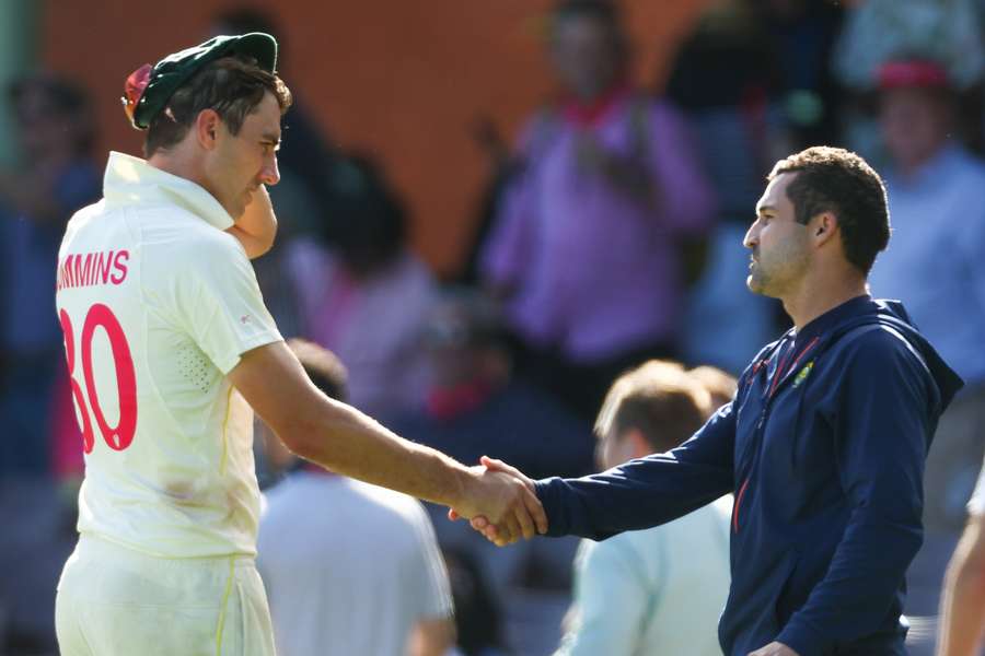 Elgar (R) shakes hand with Australia captain Pat Cummins