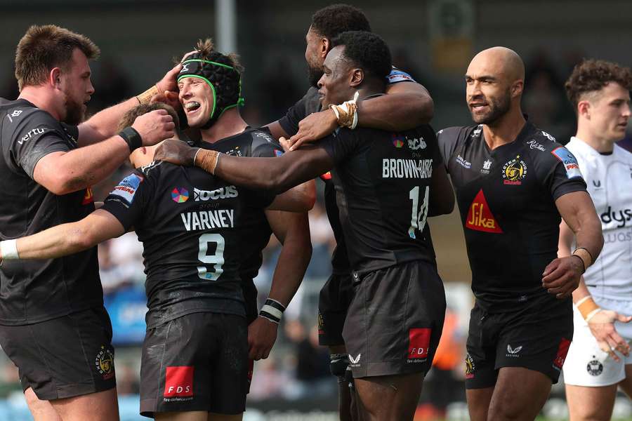 The Exeter players celebrate their vital victory over Bath The Exeter players celebrate their vital victory over Bath