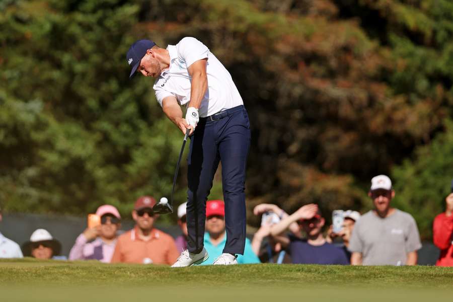 Wyndham Clark hits a shot on the 13th fairway during US Open Wyndham Clark hits a shot on the 13th fairway during US Open