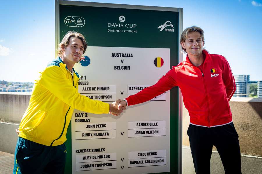 Alex De Minaur shakes hands with Zizou Bergs at the official draw for the Davis Cup tie between Australia and Belgium in Sydney.
