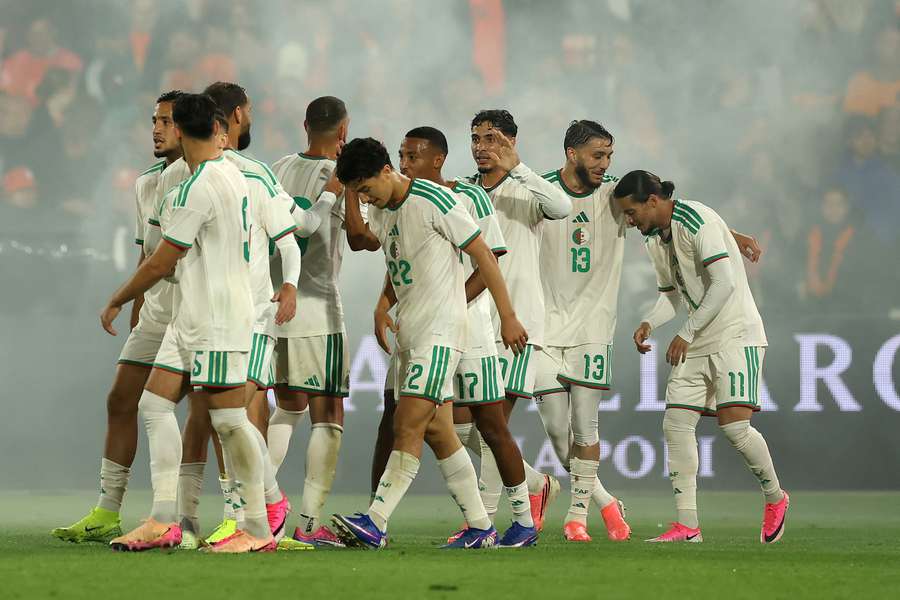 Algeria celebrate Anis Hadj Moussa's (R) 1-0 against the Netherlands