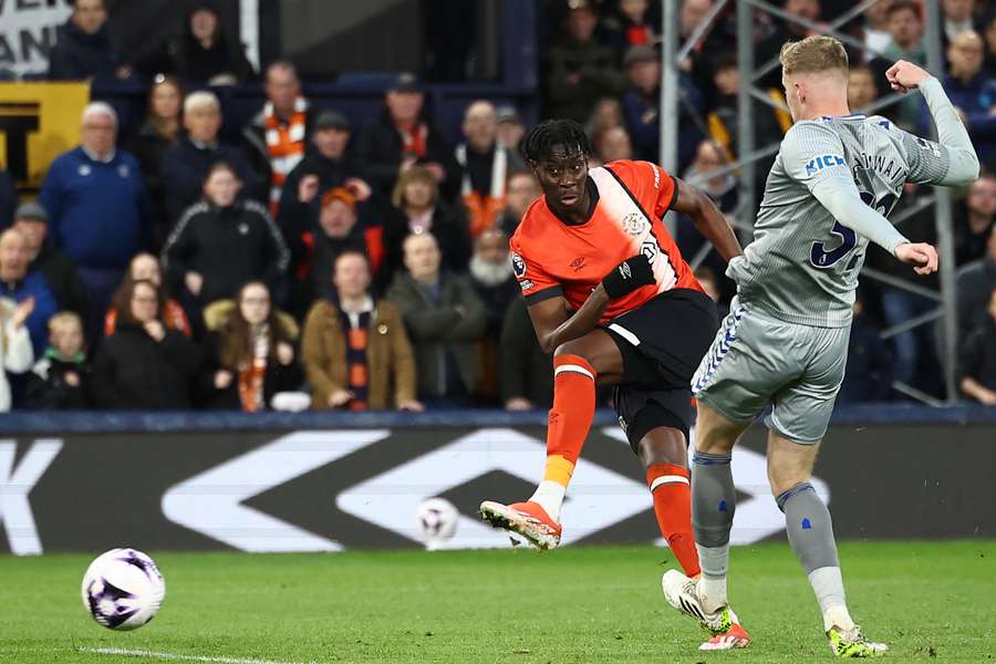 Elijah Adebayo shoots to score Luton's first goal