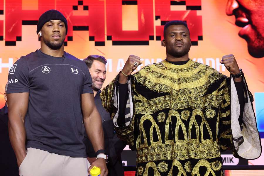 British heavyweight boxer Anthony Joshua (L) and Cameroonian boxer Francis Ngannou (R) pose after a press conference