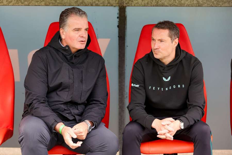 Feyenoord technical director Dennis te Kloese (L) talking to manager Brian Priske